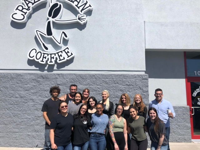 friends and employees meeting outside crazy bean